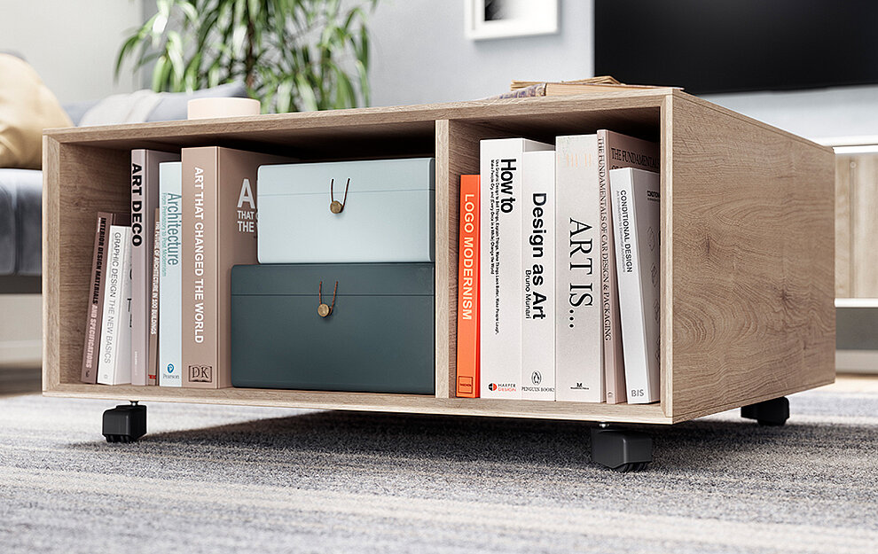 Contemporary wooden bookshelf on wheels, filled with art and design books and stylish storage boxes, against a modern living room backdrop.