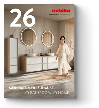 A stylish bathroom setting is featured on a magazine cover with a woman reflecting on her interior choices, representing modern home design inspiration.
