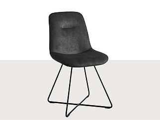 Silla negra moderna con un diseño elegante que cuenta con un cómodo respaldo curvado y patas de metal resistentes, perfecta para espacios de comedor u oficina contemporáneos.