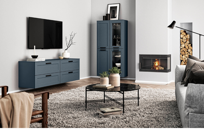 Modern living room interior featuring a cozy fireplace, sleek furniture with clean lines, and a harmonious neutral color palette accentuated by pops of navy blue.