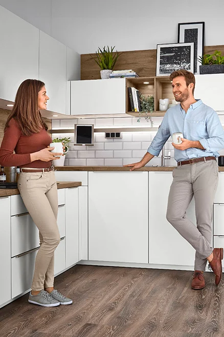 Kuchyně s přizpůsobenou pracovní výškou pro optimální ergonomii - různé aktivní výšky pro každého.