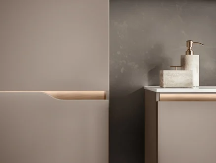 Handleless bathroom furniture with a new, elegant Curve type shape in a natural design.