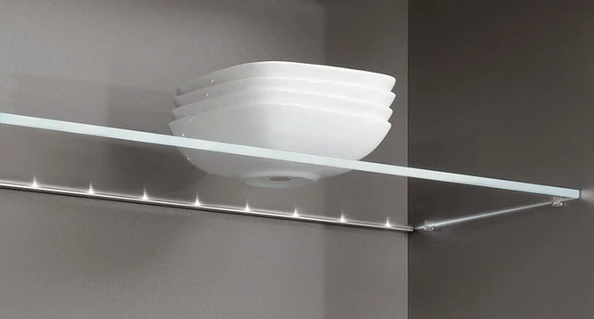 Modern wall-mounted light fixture with a layered glass shade and a horizontal metal bar containing small LED lights on a grey background.