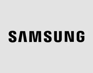 L'image affiche le texte gras et noir "SAMSUNG" centré sur un fond clair et uni, représentant le logo de la célèbre marque d'électronique.