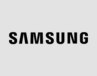 The image displays the bold, black text "SAMSUNG" centered against a plain, light background, representing the prominent electronics brand's logo.