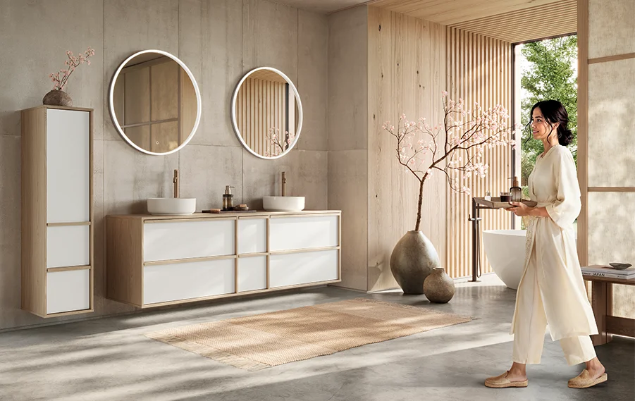 Japandi style bathroom furniture with a light wood structure, minimalist aesthetics and round mirror lighting.