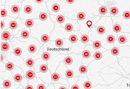 Interaktywna mapa Niemiec z wyróżnionymi różnymi lokalizacjami czerwonymi pinezkami i wskaźnikami numerycznymi reprezentującymi różne punkty danych lub interesujące lokalizacje.