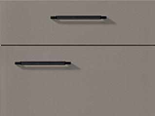 Modern minimalist kitchen drawer fronts with sleek black handles set against a neutral-toned background, emphasizing clean lines and contemporary design.