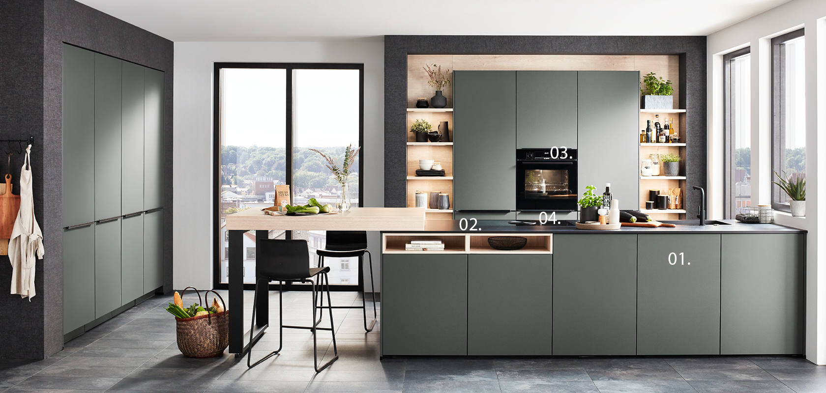 Modern kitchen with sleek green cabinets, built-in appliances, and a central island with bar stools against a backdrop of large windows and urban views.