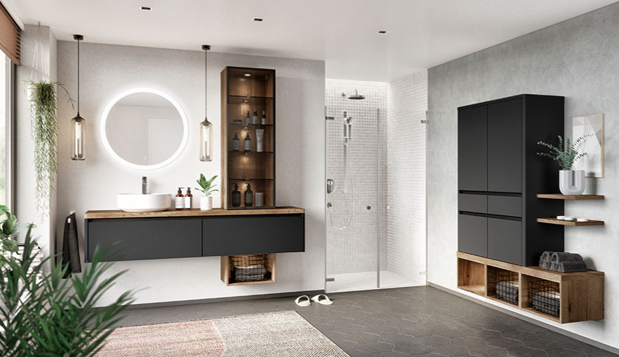 Modernes minimalistisches Badezimmer mit eleganten schwarzen Schränken, rundem Spiegel, begehbarer Dusche und geschmackvoller Dekoration, das eine ruhige und stilvolle Atmosphäre ausstrahlt.