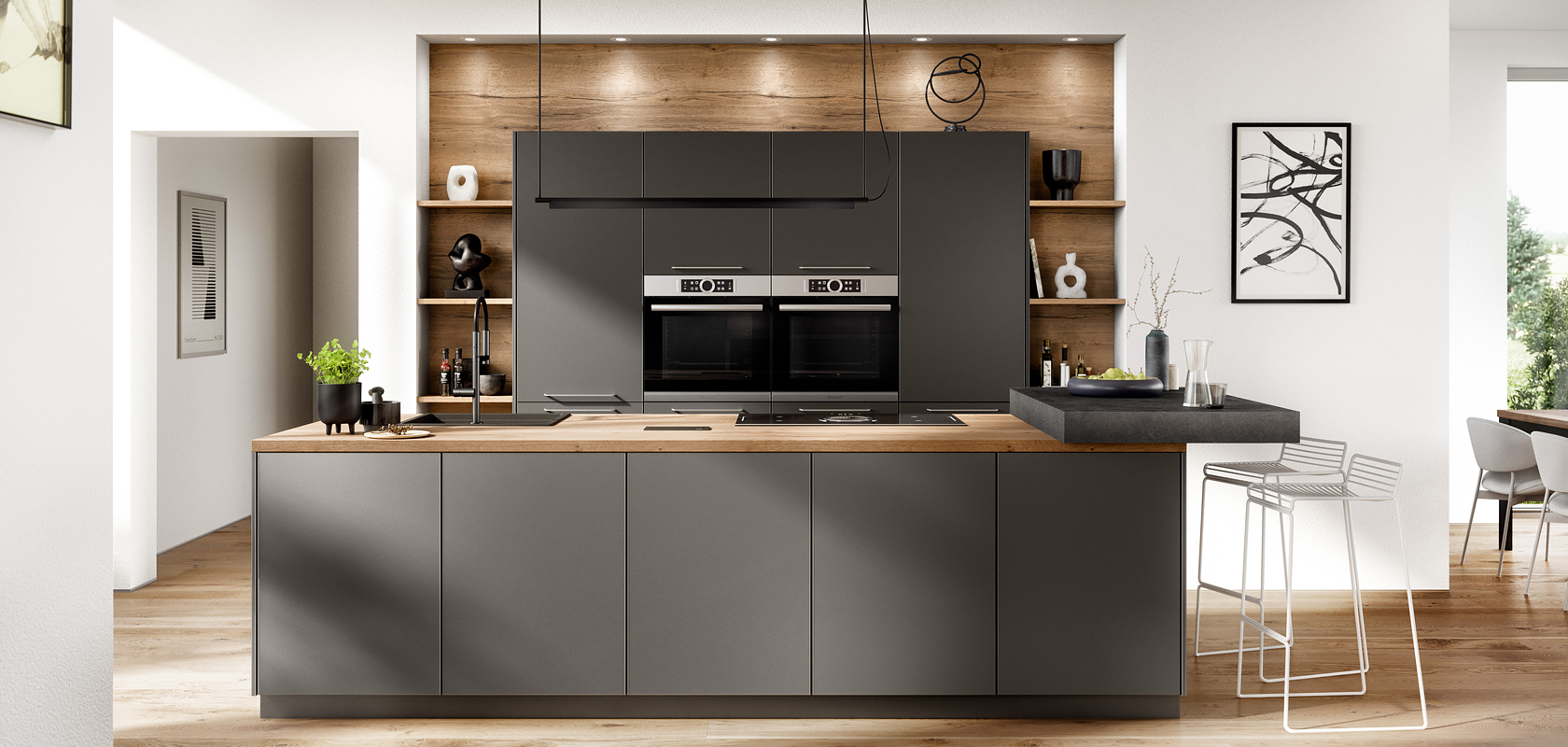 Interior de cocina moderna con elegantes gabinetes oscuros, electrodomésticos integrados y acentos de madera, combinando funcionalidad con estilo en un diseño de hogar luminoso y minimalista.