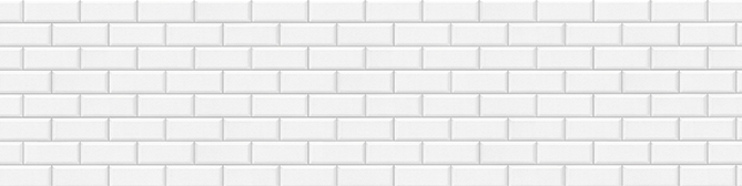Bílá textura cihlové zdi, ideální jako čisté a minimalistické pozadí pro webové stránky, vyjadřující jednoduchost a modernost.