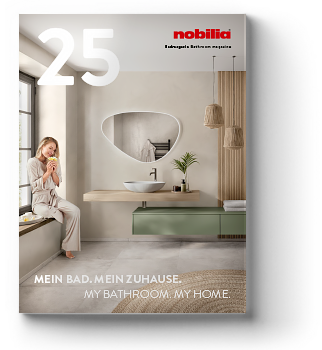 Ein stilvolles Badezimmer-Setting ist auf dem Cover einer Zeitschrift mit einer Frau abgebildet, die über ihre Inneneinrichtung nachdenkt und moderne Inspiration für das Zuhause darstellt.